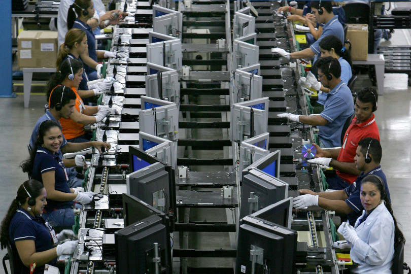 Workers check new DVD players at the assembly line of Dutch electronics company Philips at the industrial pole in Manaus, northern Brazil, on September 12, 2008. Overpassing analysts' estimation, the Brazilian economy grew by 6.1% in the second quarter of 2008 as the Central Bank raised its benchmark interest rate to 13,75% a year, following measures previously announced to keep the inflation under control. AFP PHOTO/Mauricio LIMA (Photo credit should read MAURICIO LIMA/AFP/Getty Images)